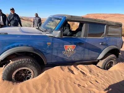 A bronco stuck in the sand